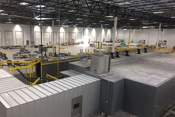 Turnkey industrial powder coating system with integrated washer, booth, and cure oven