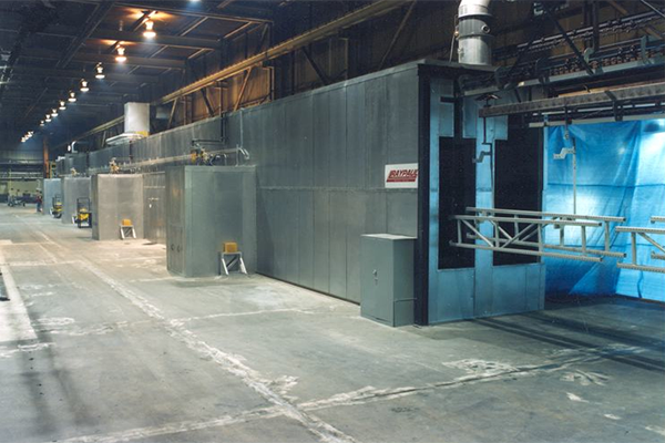 Custom industrial curing oven with four-zone temperature control, 200-foot conveyor system